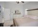 Angle view of this main bedroom featuring white walls, tile flooring, and a ceiling fan at 2520 Jasmine Trace Dr, Kissimmee, FL 34758