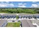 Aerial view of new townhomes featuring garages and well manicured landscaping at 2845 Pierr St, Davenport, FL 33837