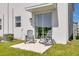 Outdoor patio featuring modern rocking chairs and sliding glass door entry at 2845 Pierr St, Davenport, FL 33837