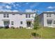 Home backyard showing lush green lawn and outdoor living area at 2845 Pierr St, Davenport, FL 33837