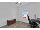 A bedroom with a cozy nook for a computer desk and a window for natural light at 2845 Pierr St, Davenport, FL 33837