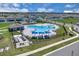 Birds eye view of community pool and surrounding neighborhood homes at 2845 Pierr St, Davenport, FL 33837
