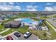 Aerial view of a community pool, clubhouse, playground and parking area at 2845 Pierr St, Davenport, FL 33837