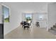 Bright open-plan dining room featuring a modern table and chairs with access to the kitchen at 2845 Pierr St, Davenport, FL 33837