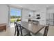 Open dining area connecting to a bright kitchen with ample counter space and natural light at 2845 Pierr St, Davenport, FL 33837