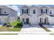Charming two-story townhome featuring a private garage and a welcoming front porch at 2845 Pierr St, Davenport, FL 33837