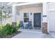 Charming front porch with rocking chairs and stone pillar accents at 2845 Pierr St, Davenport, FL 33837