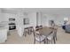 Bright living room featuring modern decor, an open layout, and a kitchen island with bar seating at 2845 Pierr St, Davenport, FL 33837