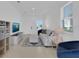 Bright living room featuring tile flooring, a white sofa, and recessed lighting at 2845 Pierr St, Davenport, FL 33837