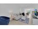 Living room with tile floors, white sofa and easy access to the dining room at 2845 Pierr St, Davenport, FL 33837