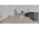 Open living room featuring tile floors and easy access to the entryway and kitchen at 2845 Pierr St, Davenport, FL 33837