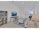 Bright living room with neutral decor, tile floors, and recessed lighting at 2845 Pierr St, Davenport, FL 33837