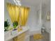 Bright bathroom featuring a bathtub, shower, and yellow accents at 2908 Sunset Lakes Blvd, Kissimmee, FL 34747