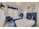 Comfortable bedroom with two beds, natural light, stylish decor, and soft textures for a relaxing retreat at 2908 Sunset Lakes Blvd, Kissimmee, FL 34747