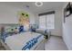 Bright ' bedroom featuring twin beds with Star Wars themed bedding and decor at 2908 Sunset Lakes Blvd, Kissimmee, FL 34747