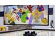 Entertainment room with a mural, air hockey table, and fun decor at 2908 Sunset Lakes Blvd, Kissimmee, FL 34747