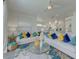 Bright living room features comfortable seating, stylish rug, and lots of natural light at 2908 Sunset Lakes Blvd, Kissimmee, FL 34747