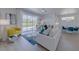 Open-concept living area featuring modern furnishings, bright windows, and stylish decor, perfect for entertaining at 2908 Sunset Lakes Blvd, Kissimmee, FL 34747