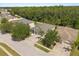 Overhead shot of a charming house nestled in a neighborhood with lush trees and manicured lawns at 3641 Bristol Cove Ln, St Cloud, FL 34772