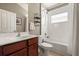 Neat bathroom with a shower and bath combination, plus a sleek wooden vanity at 3641 Bristol Cove Ln, St Cloud, FL 34772