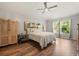 Inviting bedroom with a plush bed, wood floors, and serene ambiance for restful nights at 3641 Bristol Cove Ln, St Cloud, FL 34772