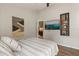 Stylish bedroom with wood floors, modern decor, and easy access to the ensuite bathroom at 3641 Bristol Cove Ln, St Cloud, FL 34772