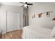 Bright bedroom with a ceiling fan, closet space, and access to the ensuite bathroom at 3641 Bristol Cove Ln, St Cloud, FL 34772