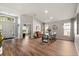 An open-concept entryway features hardwood floors, a dining area, and ample natural light at 3641 Bristol Cove Ln, St Cloud, FL 34772