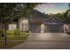 Charming home exterior featuring a well-manicured lawn, two-car garage, and welcoming entryway at 3641 Bristol Cove Ln, St Cloud, FL 34772