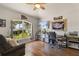 Bright home office with large window, desk, and comfortable seating for a productive workspace at 3641 Bristol Cove Ln, St Cloud, FL 34772