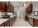 Well-equipped kitchen with stainless steel appliances, granite countertops, and ample cabinet space at 3641 Bristol Cove Ln, St Cloud, FL 34772