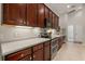 Well-equipped kitchen with stainless steel appliances, granite countertops, and ample cabinet space at 3641 Bristol Cove Ln, St Cloud, FL 34772