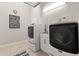 Efficient laundry room with modern washer, dryer, utility sink, and stylish decor at 3641 Bristol Cove Ln, St Cloud, FL 34772