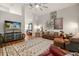 A spacious living room features hardwood floors, stylish decor, and a view to an adjoining area at 3641 Bristol Cove Ln, St Cloud, FL 34772