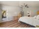 Spacious main bedroom with wood floors, natural light, and ensuite bath access for convenience at 3641 Bristol Cove Ln, St Cloud, FL 34772