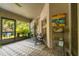 Relaxing screened patio featuring comfortable seating, plants and views of the lush backyard at 3641 Bristol Cove Ln, St Cloud, FL 34772