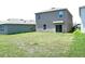 The backyard features a well-maintained lawn, creating a perfect space for outdoor activities and relaxation at 3673 Caspian St, Leesburg, FL 34748