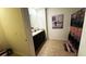 Bathroom featuring double sinks, granite countertops, dark cabinets, a shower, and a decorative curtain at 3673 Caspian St, Leesburg, FL 34748