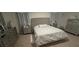 Bedroom featuring a bed, two nightstands, and curtains, offering a comfortable and relaxing space at 3673 Caspian St, Leesburg, FL 34748