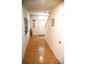 Inviting hallway with tile flooring, neutral colored walls and natural light creating a warm and welcoming atmosphere at 3673 Caspian St, Leesburg, FL 34748