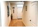 Inviting hallway with tile flooring, neutral colored walls and natural light creating a warm and welcoming atmosphere at 3673 Caspian St, Leesburg, FL 34748