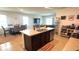 This kitchen features a large island, modern appliances, and is open to the dining and living areas at 3673 Caspian St, Leesburg, FL 34748