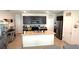 Open kitchen with a large island, stainless steel appliances and dark wood cabinets at 3673 Caspian St, Leesburg, FL 34748