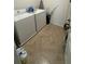 Functional laundry room featuring a white washer and dryer, ready for convenience at 3673 Caspian St, Leesburg, FL 34748