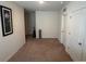 Empty room with neutral carpeting, offering a blank canvas for personalization and various living arrangements at 3673 Caspian St, Leesburg, FL 34748