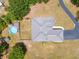 Aerial rooftop view featuring an above-ground pool and a winding driveway on a grassy lot at 3720 Edsel Ave, St Cloud, FL 34772