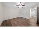 Bedroom showcases a ceiling fan and closet with luxury vinyl plank flooring at 3720 Edsel Ave, St Cloud, FL 34772