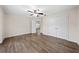Neutral bedroom features a ceiling fan and a closet for ample storage space at 3720 Edsel Ave, St Cloud, FL 34772