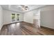 Bright bedroom with wood-look floors and French doors leading to outdoor area at 3720 Edsel Ave, St Cloud, FL 34772