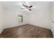 Bright and airy bedroom features a ceiling fan and modern flooring at 3720 Edsel Ave, St Cloud, FL 34772